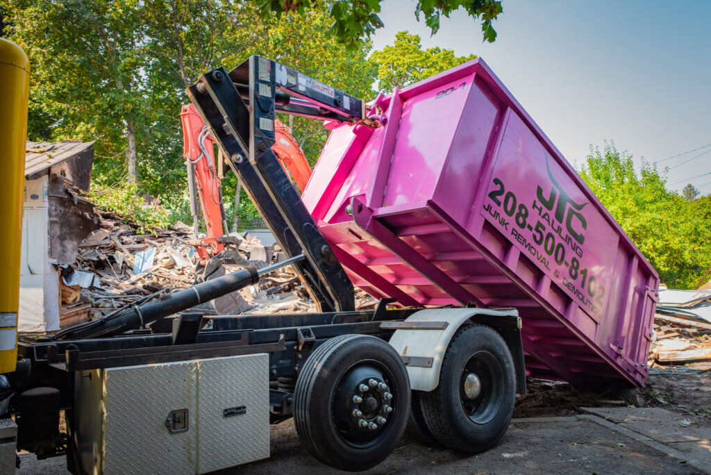 JTC Demolition Latest Trucks removing debris locally